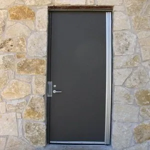 Metal door with stone frame